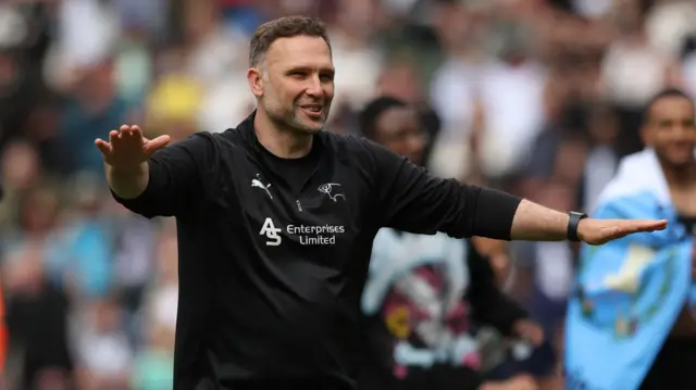 Derby boss John Eustace celebrates staying up after the 0-0 draw with Stoke