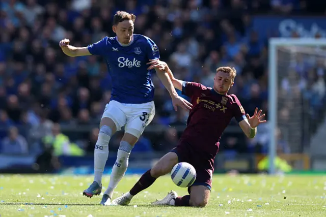 James Garner of Everton is challenged by Jack Taylor