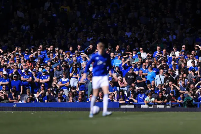 Fans shield their eyes