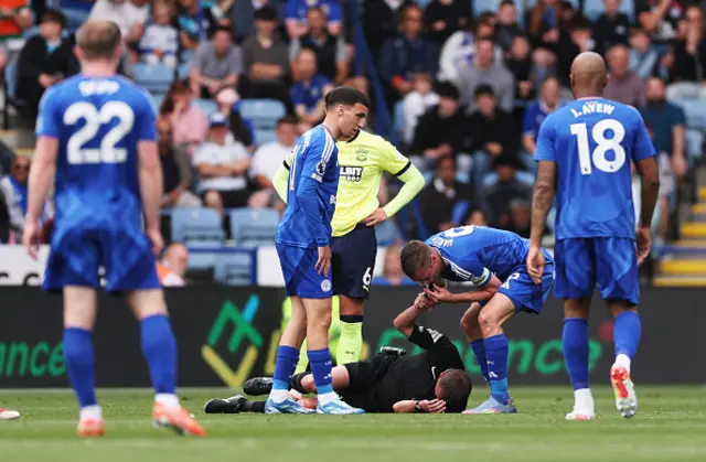 Jamie Vardy of Leicester City blows referee David Webb's whistle