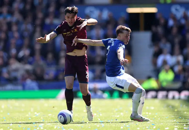 Jacob Greaves of Ipswich Town is challenged by Nathan Patterson