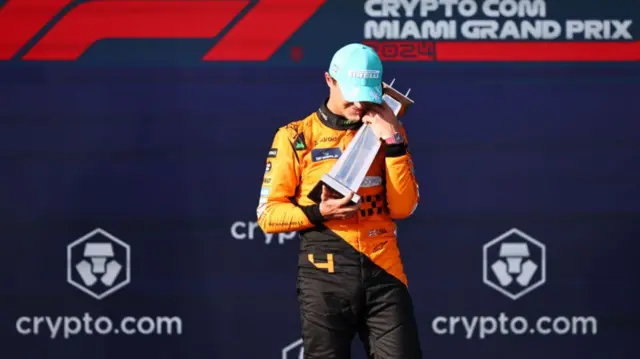 McLaren's Lando Norris holds his trophy after winning the 2024 Miami Grand Prix