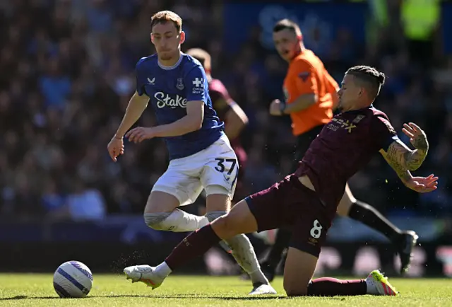 Kalvin Phillips (R) tackles Everton's English midfielder James Garner
