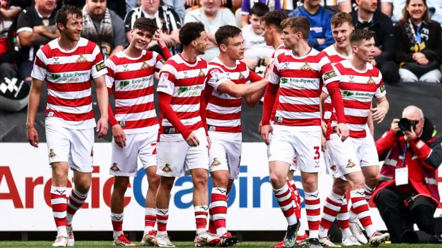 Doncaster players celebrate