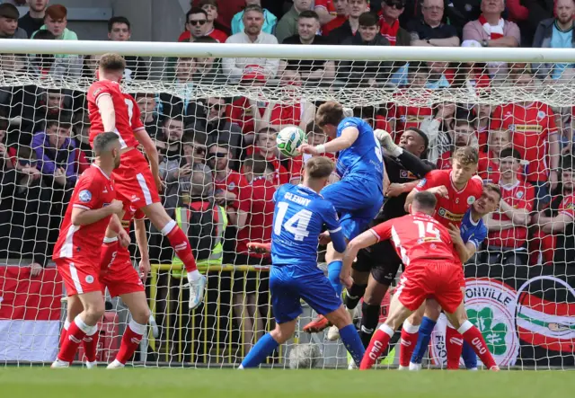 James Knowles' corner is headed home by John McGovern