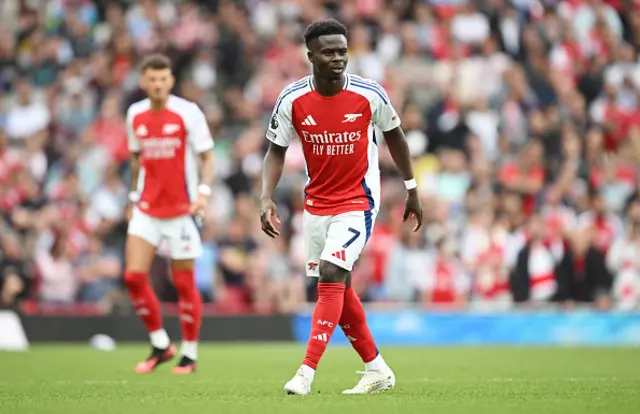 Bukayo Saka of Arsenal looks on