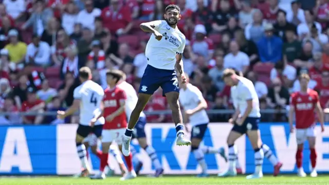 Preston's Kaine Kesler-Hayden jumps for joy after Emil Riis' goal at Bristol City