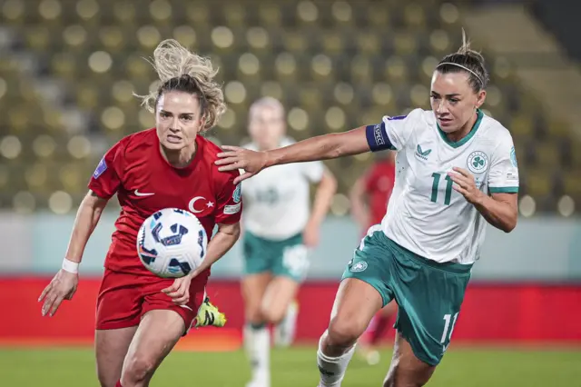 Katie McCabe battling for the ball