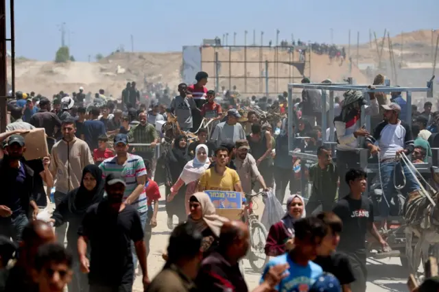 Palestinians desperate for food mass at distribution centres run by the Gaza Humanitarian Foundation since the blockade was eased