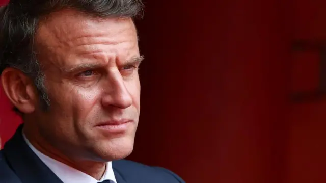 A file photo of French President Emmanuel Macron. The photo is close up and taken from the side, Macron looks off camera and is wearing a suit