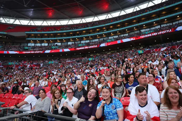Fans smile at Wembley