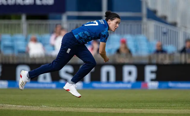 Em Arlott bowls