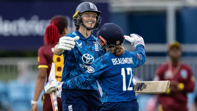 Amy Jones is embraced by Tammy Beaumont after reaching her maiden ODI century