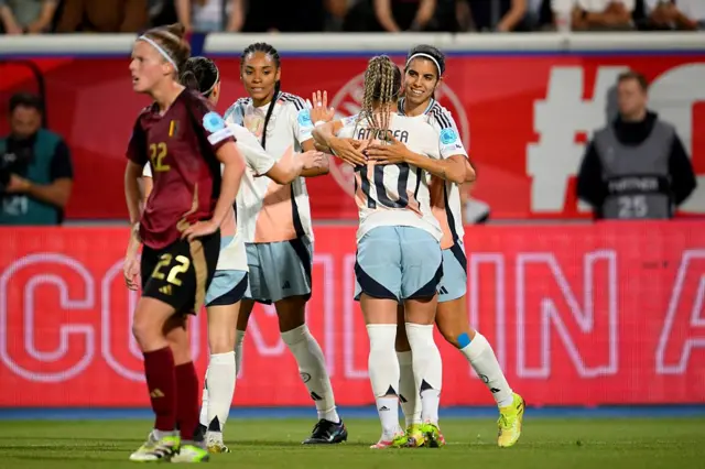 Redondo celebrates her goal with teammates