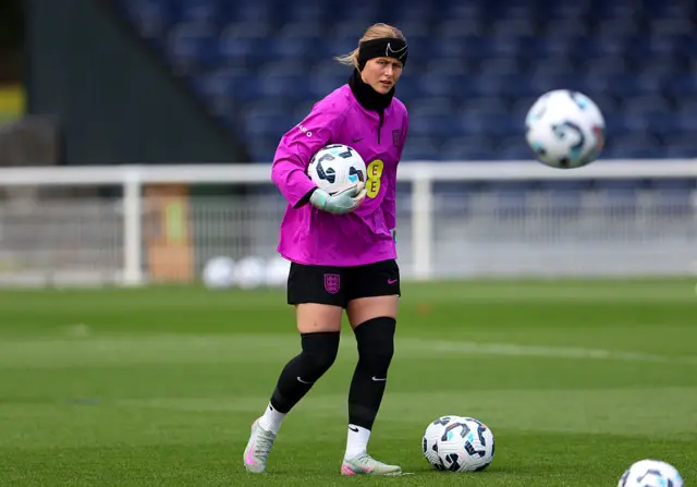 Hannah Hampton controls a ball in training