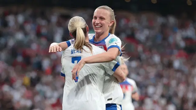 Aggie Beever-Jones celebrates with Beth Mead