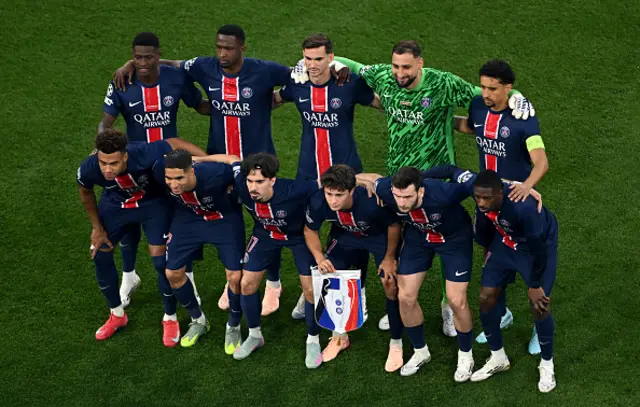 Players of Paris Saint-Germain pose for a team photograph