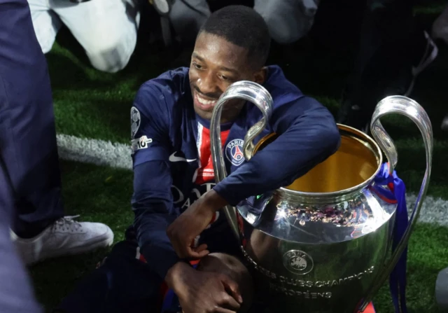 Ousmane Dembele of PSG celebrates with the trophy