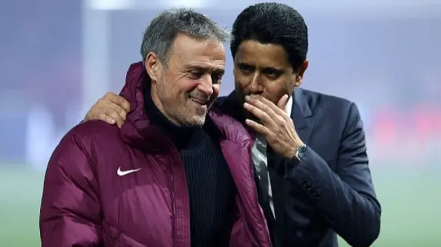 Paris Saint-Germain's Spanish headcoach Luis Enrique (L) smiles as he talks with Paris Saint Germain's Qatari President Nasser al-Khelaifi