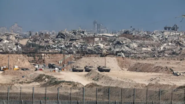Israeli troops enter the northern Gaza Strip. Rubbles and debris of bombed out homes in the background
