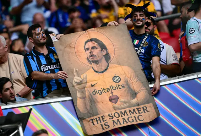 Inter Milan supporters hold an image of Inter Milan's Swiss goalkeeper #01 Yann Sommer