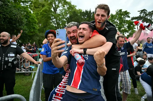 Football fans celebrate after PSG scored their second goal