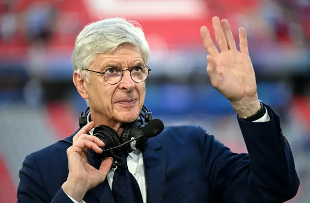Arsene Wenger looks on