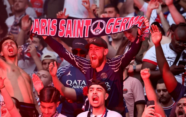 Fans of PSG celebrate a goal of their team during a public viewing of the UEFA Champions League