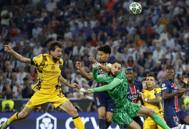 Inter Milan's Francesco Acerbi in action with Paris St Germain's Gianluigi Donnarumma