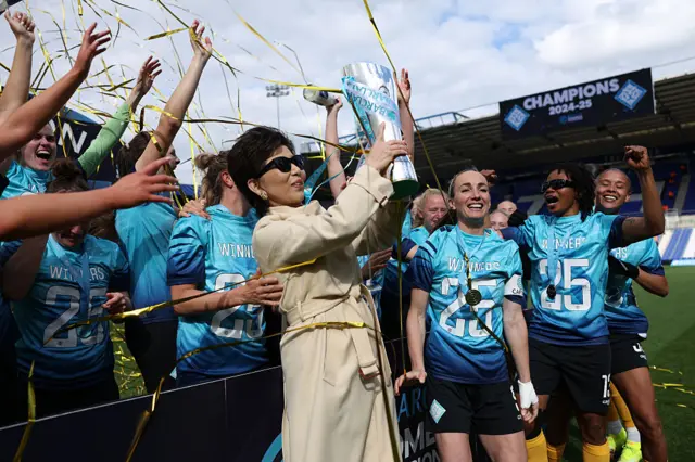 Michele Kang, Owner of London City Lionesses, celebrates with the Barclays Women's Championship trophy