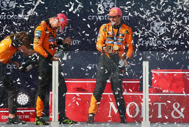 Lando Norris and Oscar Piastri spray champagne