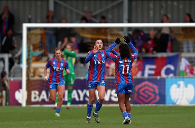 Abbie Larkin of Crystal Palace celebrates scoring her team's second goal with teammate Ashleigh Weerden during the Barclays Women's Super League match between Crystal Palace and Leicester City at VBS Community Stadium