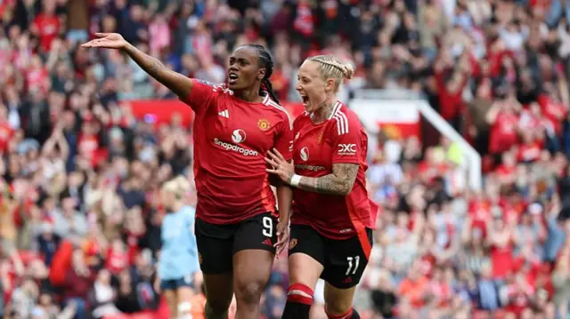 Melvine Malard celebrates with Leah Galton