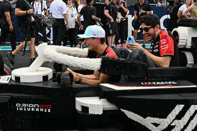 Oliver Bearman and Estean Ocon sit in the Lego car