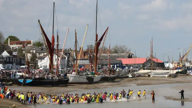 Competitors run into the water at the start of the Maldon Mud Race