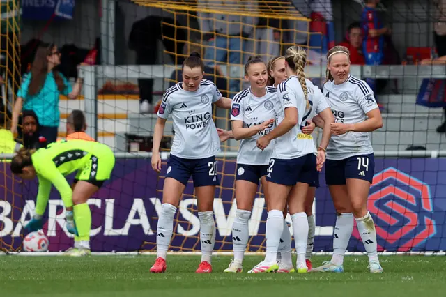 Hannah Cain of Leicester City celebrates scoring her team's first goal with teammates