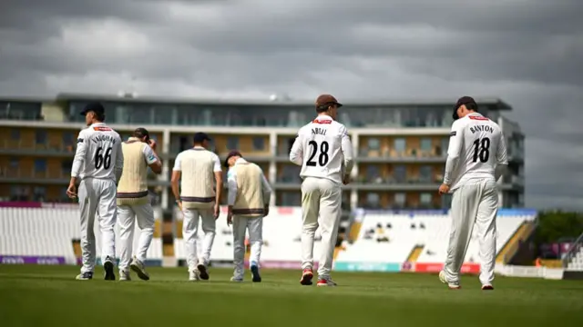 Somerset coming out to field