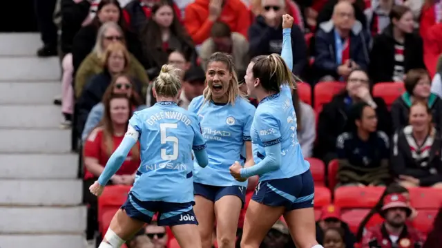Man City celebrate their first goal