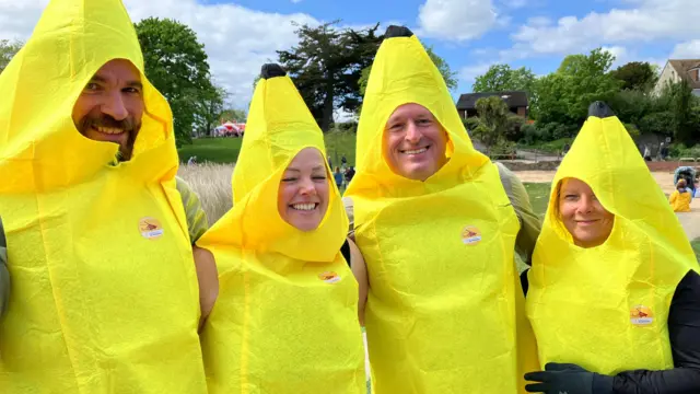 Dave, Sally, Kevin and Claire are dressed as bananas.