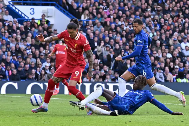 Darwin Nunez of Liverpool is challenged by Trevoh Chalobah