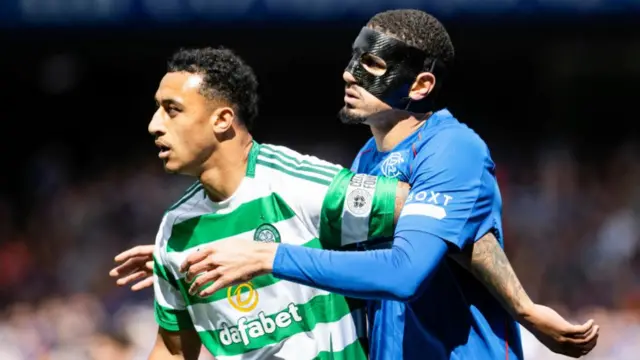 Celtic's Adam Idah with Rangers' Leon Balogun