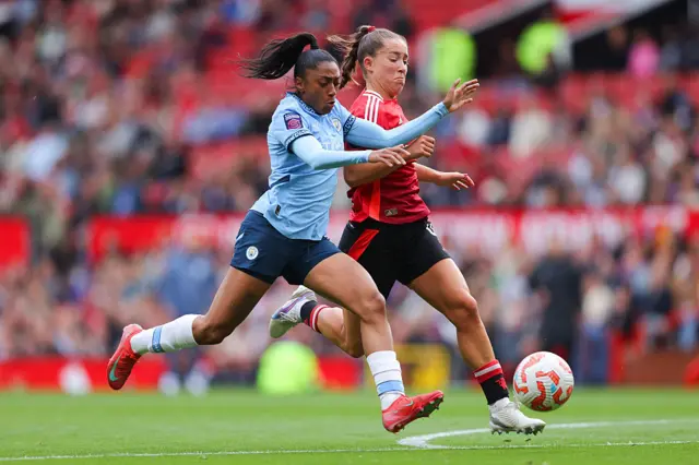 Kerolin and Maya Le Tissier compete for the ball