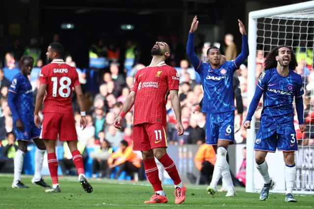Mohamed Salah (C) reacts