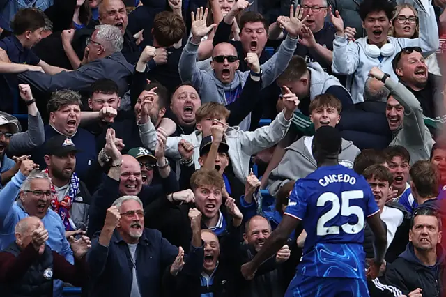 Moises Caicedo celebrates with fans after winning a penalty