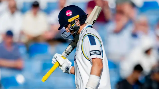 Yorkshire's Joe Root looks dejected as he leaves the pitch after getting out