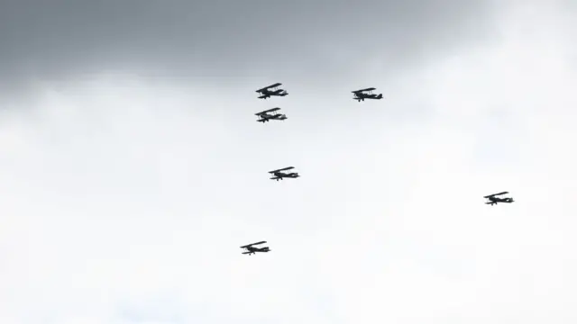 Planes flying over ground
