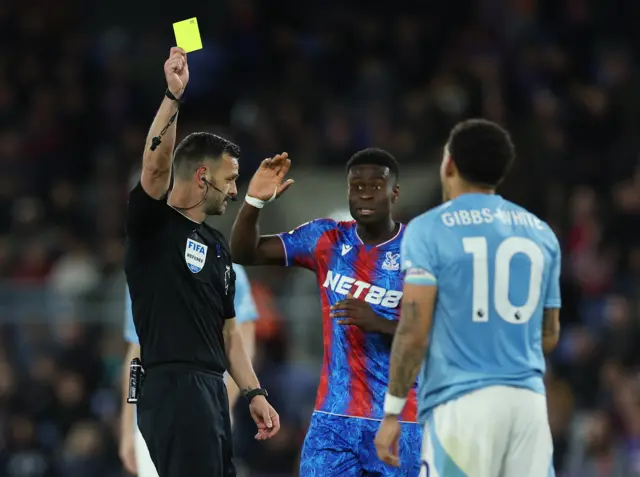 Nottingham Forest's Morgan Gibbs-White is shown a yellow card by referee Andy Madley