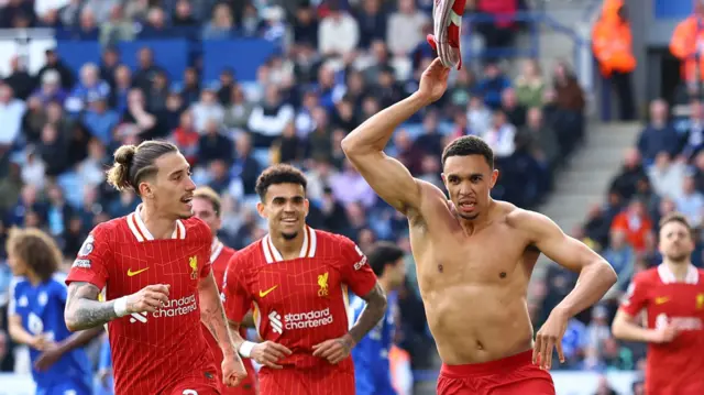 Trent Alexander-Arnold celebrating bare chested after scoring Liverpool's winner at Leicester