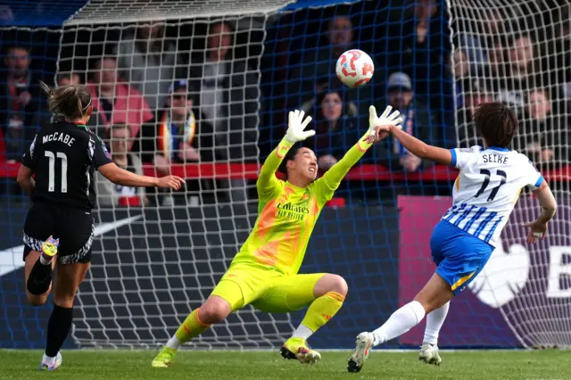 Brighton and Hove Albion's Kiko Seike (right) scores their side's fourth goal