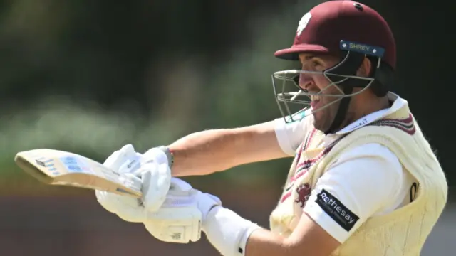 Craig Overton hits the ball